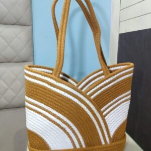 Handcrafted brown and white cotton rope tote bag with elegant curved stripe pattern and long shoulder handles for women.